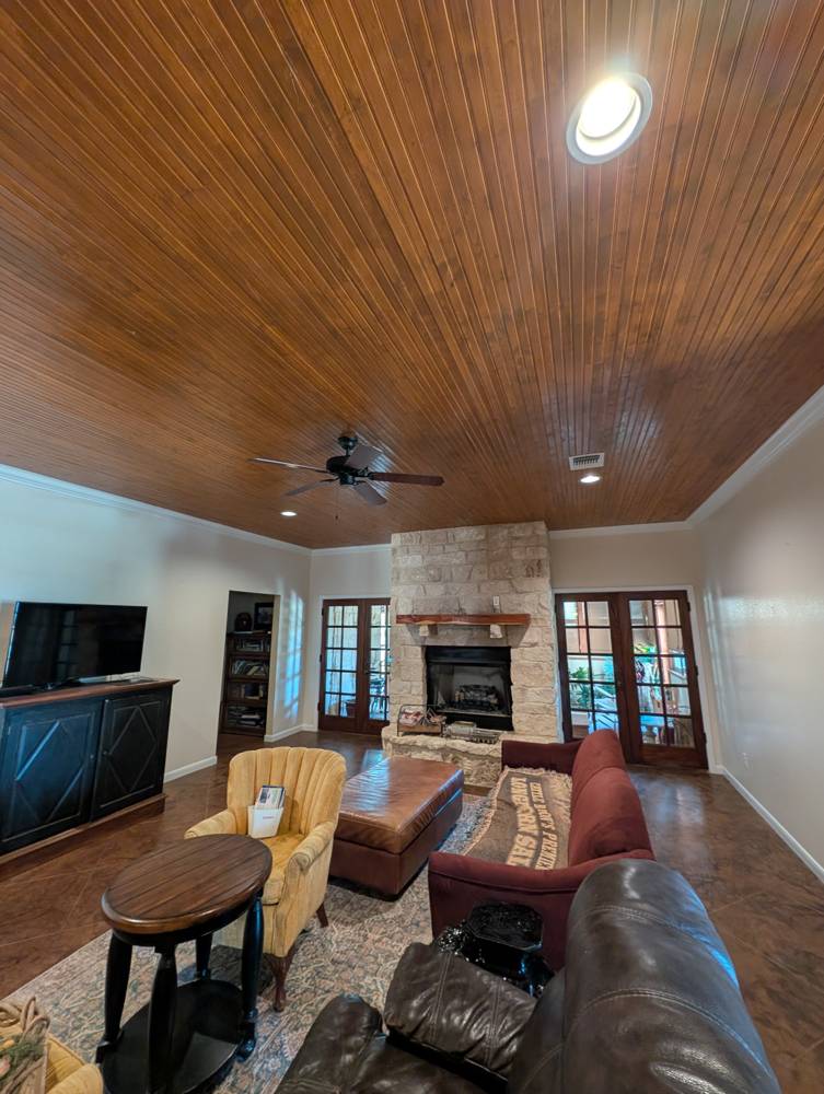 Stained beadboard living room ceiling