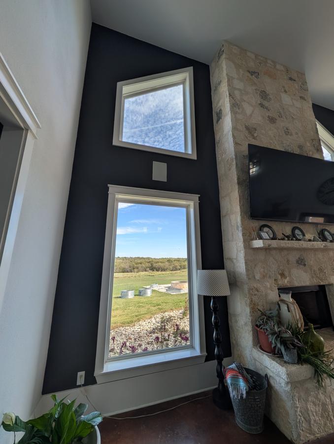 Iron Ore accent wall by the stone fireplace