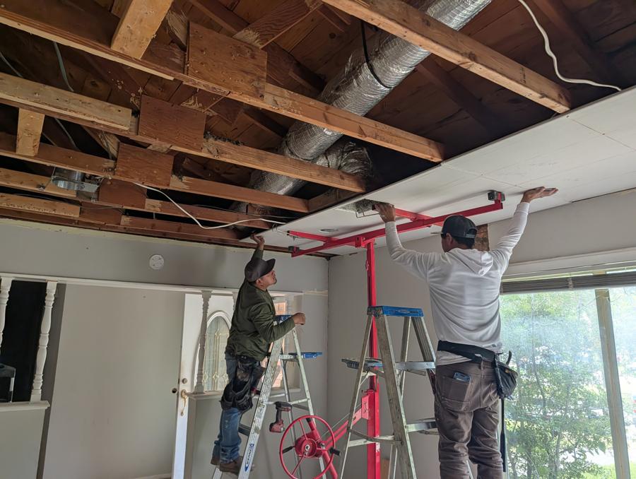 Sagging old sheetrock torn out and replaced