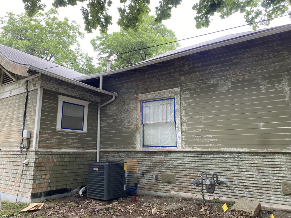 Siding patched and scraped